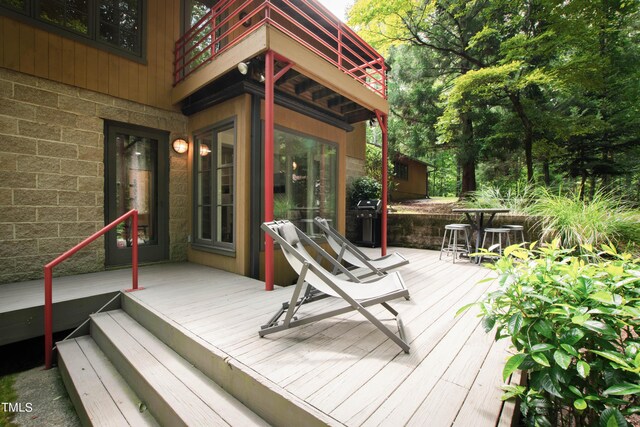 wooden deck featuring grilling area