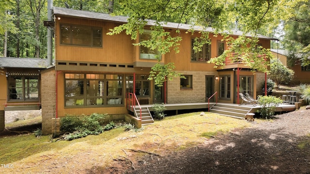 rear view of house featuring french doors
