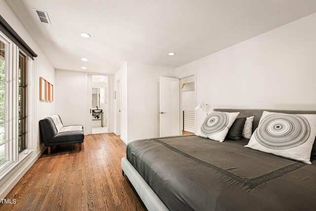 bedroom with hardwood / wood-style floors