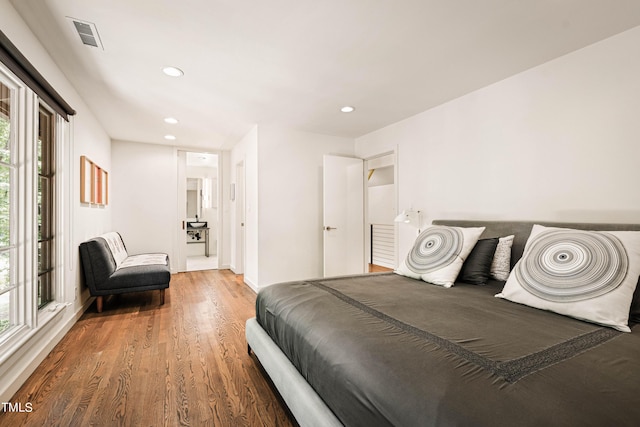 bedroom featuring visible vents, wood finished floors, and recessed lighting