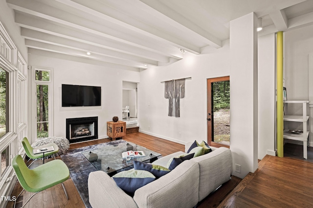 living room with baseboards, a fireplace, wood finished floors, and beamed ceiling