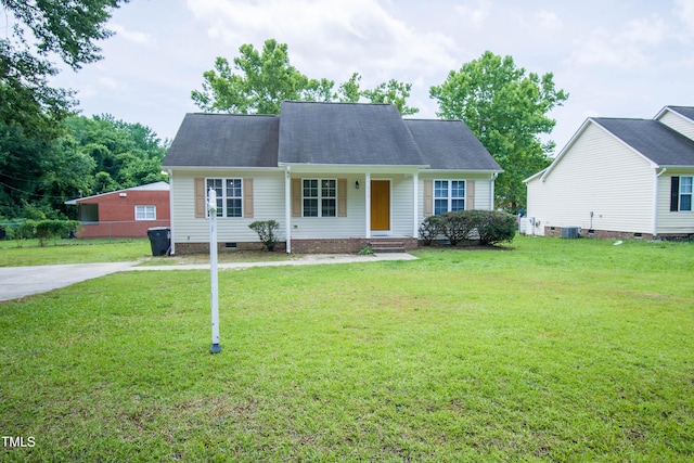 310 E Horton St, Zebulon, NC 27597 - view of front facade with crawl space, a front lawn, a porch, central AC, and a shingled roof