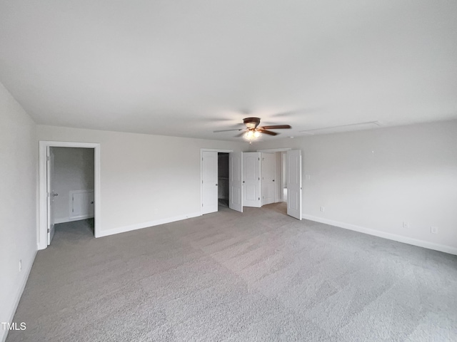 unfurnished room with ceiling fan and carpet flooring