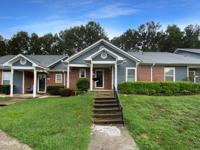 view of front of home with a front lawn