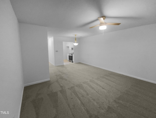 unfurnished living room featuring carpet flooring and ceiling fan