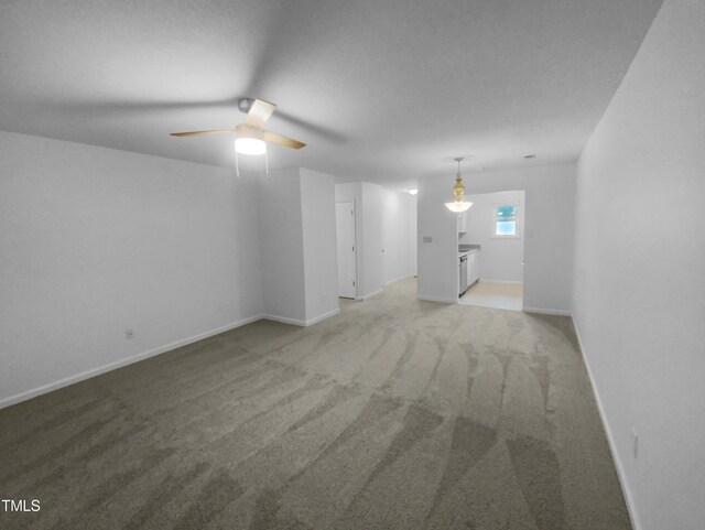 603 Pine Forest Trl, Knightdale, NC 27545 - unfurnished living room with ceiling fan and carpet flooring