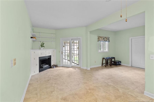 unfurnished living room with french doors