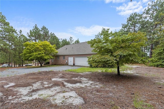 view of side of property featuring a garage