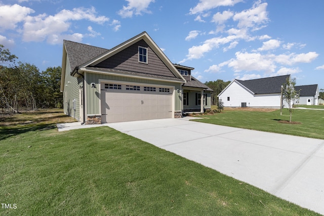 craftsman-style house with a garage and a front lawn