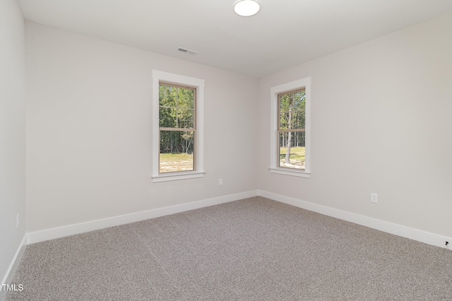 unfurnished room with carpet floors