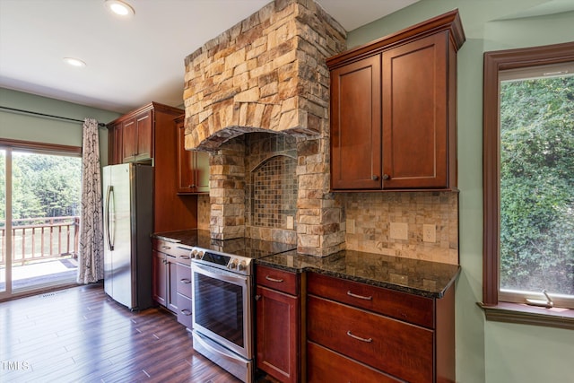 3240 Hillcastle Trl, Chapel Hill, NC 27516 - kitchen featuring appliances with stainless steel finishes, dark stone counters, tasteful backsplash, dark wood-style flooring, and recessed lighting