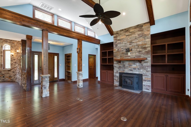 unfurnished living room featuring dark hardwood / wood-style flooring, built in shelves, ceiling fan, high vaulted ceiling, and a wood stove