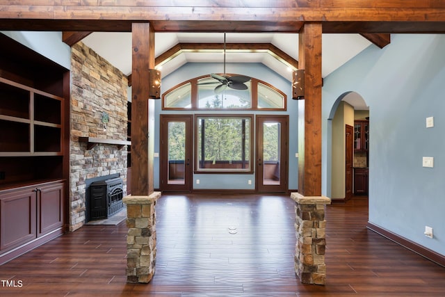 3240 Hillcastle Trl, Chapel Hill, NC 27516 - entryway featuring ceiling fan, dark wood-type flooring, arched walkways, a wood stove, and decorative columns