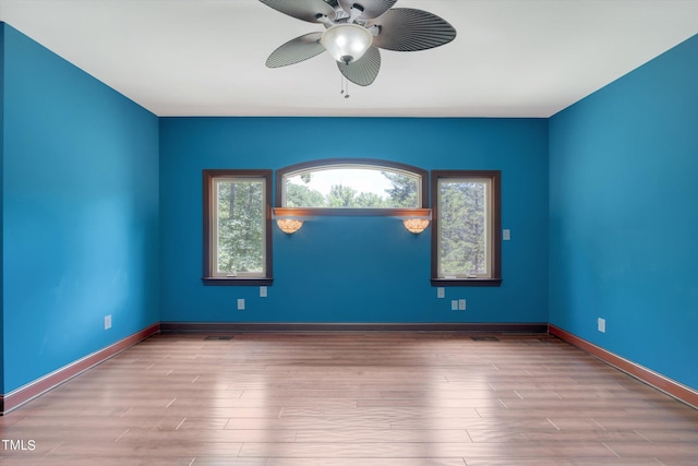 spare room with ceiling fan and light hardwood / wood-style floors