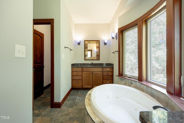 3240 Hillcastle Trl, Chapel Hill, NC 27516 - full bath featuring vanity, a tub with jets, and stone finish floors