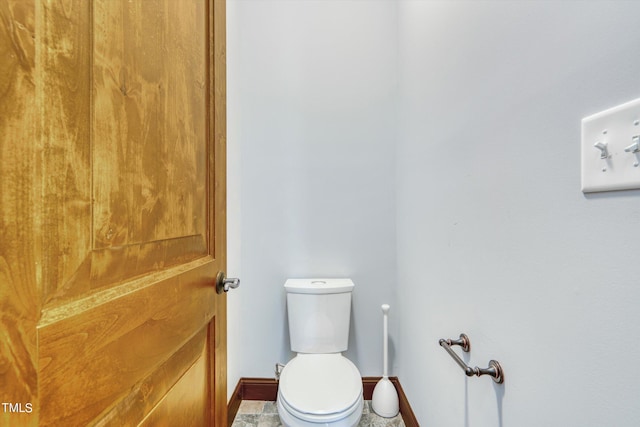 bathroom featuring tile patterned floors and toilet