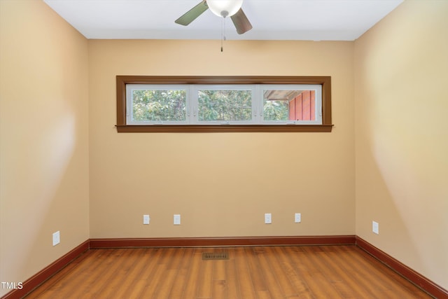 spare room featuring ceiling fan and hardwood / wood-style flooring