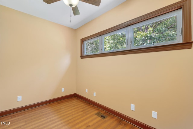 spare room featuring ceiling fan and wood-type flooring