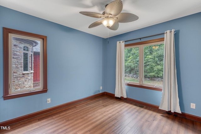 unfurnished room with wood-type flooring and ceiling fan