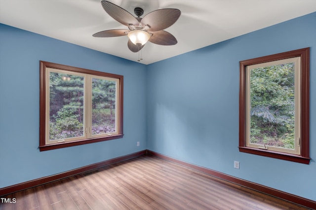 unfurnished room featuring light wood-type flooring and ceiling fan