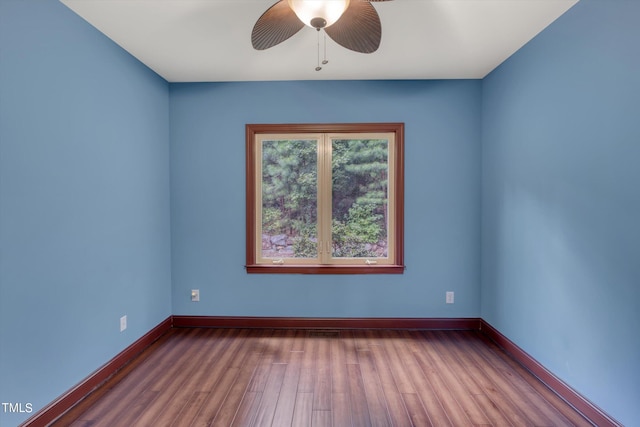 spare room featuring ceiling fan and hardwood / wood-style flooring