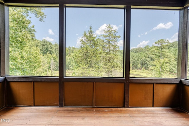 unfurnished sunroom featuring a healthy amount of sunlight