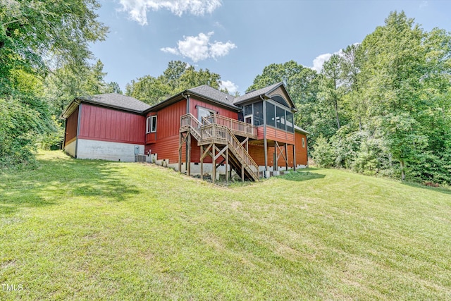 3240 Hillcastle Trl, Chapel Hill, NC 27516 - rear view of house with a sunroom, a wooden deck, stairs, and a lawn