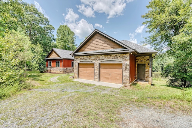 3240 Hillcastle Trl, Chapel Hill, NC 27516 - view of front facade featuring stone siding, a front lawn, an attached garage, and roof with shingles