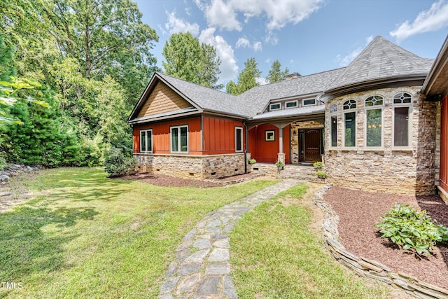 3240 Hillcastle Trl, Chapel Hill, NC 27516 - view of front of house featuring stone siding, a front lawn, and covered porch