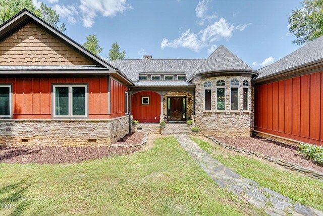 3240 Hillcastle Trl, Chapel Hill, NC 27516 - view of front facade with stone siding, a front lawn, and a chimney