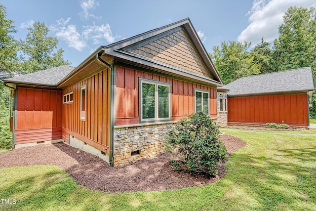 3240 Hillcastle Trl, Chapel Hill, NC 27516 - view of home's exterior with board and batten siding, crawl space, a yard, and a shingled roof