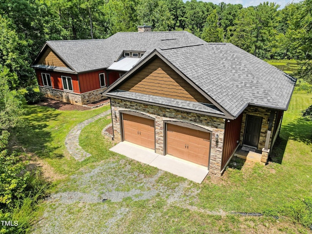 3240 Hillcastle Trl, Chapel Hill, NC 27516 - view of front of house with stone siding, dirt driveway, a front lawn, a shingled roof, and a chimney