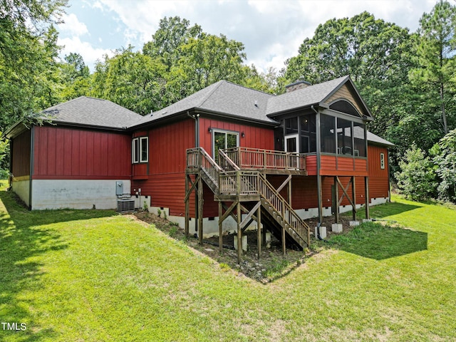 3240 Hillcastle Trl, Chapel Hill, NC 27516 - back of property featuring a sunroom, stairway, a wooden deck, a shingled roof, and a lawn