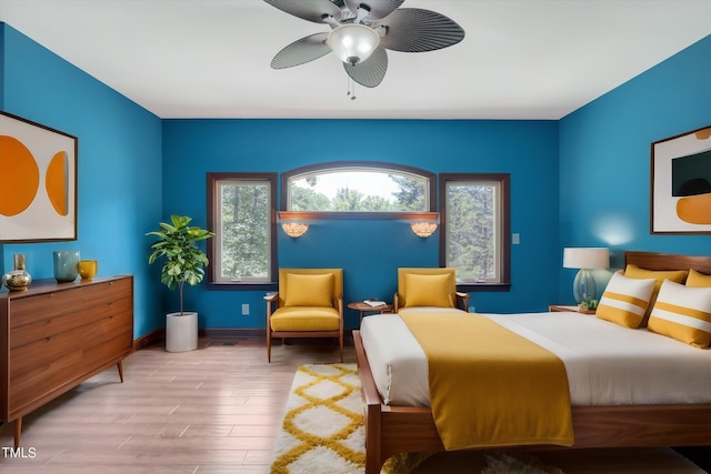 bedroom featuring light hardwood / wood-style flooring and ceiling fan