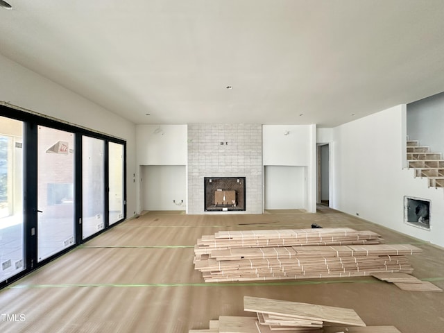 unfurnished living room with light wood-style floors and a fireplace