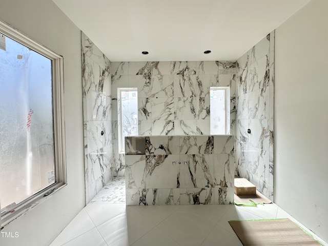 full bathroom with a marble finish shower