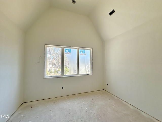 empty room with lofted ceiling