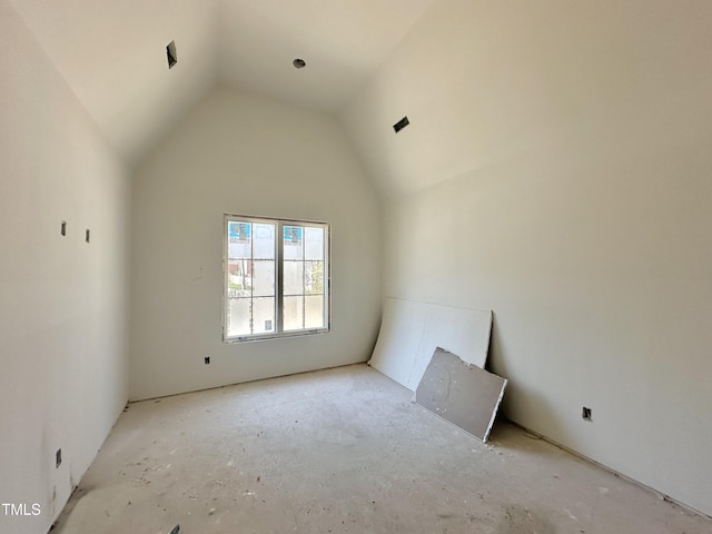 spare room featuring vaulted ceiling