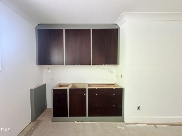 kitchen featuring dark brown cabinetry