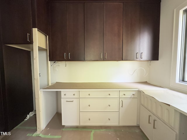 7208 Tanbark Way, Raleigh, NC 27615 - kitchen featuring light countertops and dark brown cabinetry
