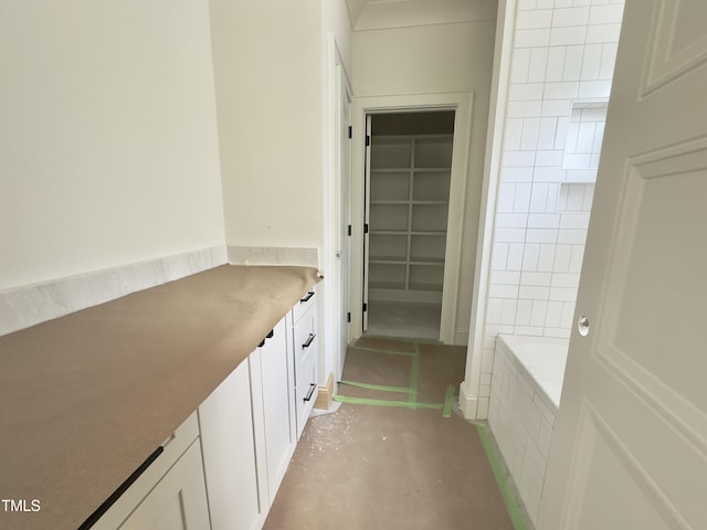 7208 Tanbark Way, Raleigh, NC 27615 - full bathroom with vanity, walk in shower, a bath, and a spacious closet
