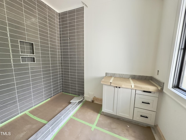 7208 Tanbark Way, Raleigh, NC 27615 - interior space featuring baseboards and a tile shower