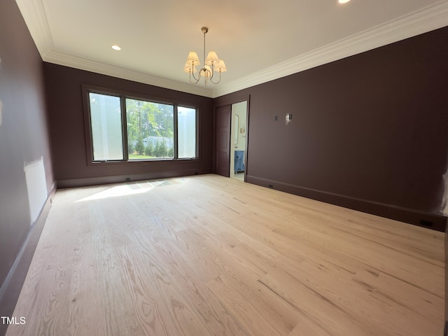 7208 Tanbark Way, Raleigh, NC 27615 - spare room featuring a chandelier, crown molding, light wood-type flooring, and recessed lighting