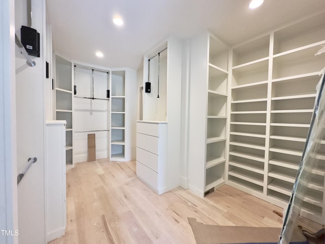 7208 Tanbark Way, Raleigh, NC 27615 - spacious closet featuring light wood-style floors