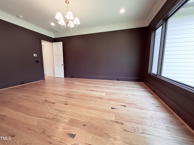 7208 Tanbark Way, Raleigh, NC 27615 - empty room with a chandelier, ornamental molding, light wood-style floors, healthy amount of natural light, and recessed lighting