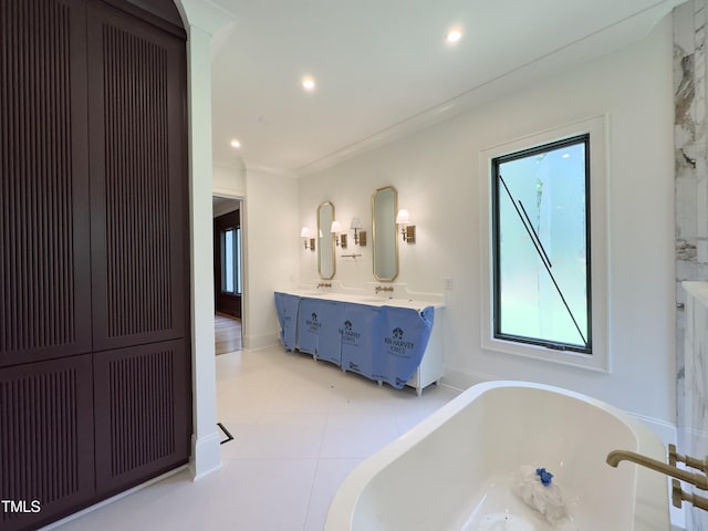 7208 Tanbark Way, Raleigh, NC 27615 - bathroom with a freestanding bath, double vanity, recessed lighting, and crown molding