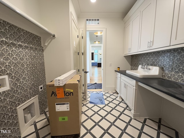 7208 Tanbark Way, Raleigh, NC 27615 - laundry area with cabinet space, hookup for a washing machine, and light floors