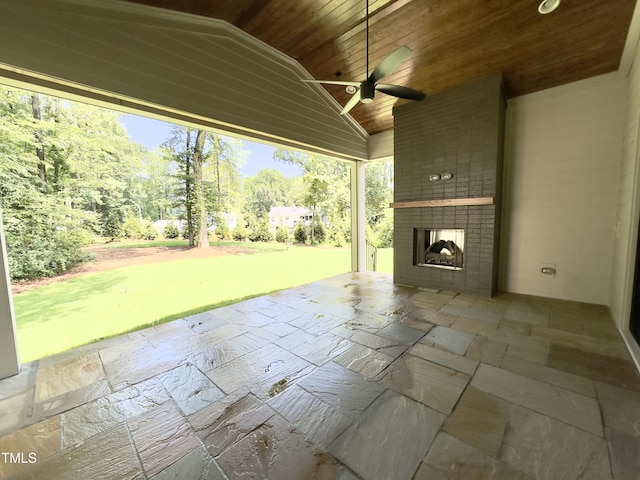 7208 Tanbark Way, Raleigh, NC 27615 - view of patio / terrace with an outdoor brick fireplace and a ceiling fan