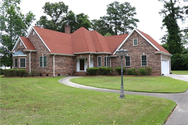 view of front facade with a front lawn and a garage