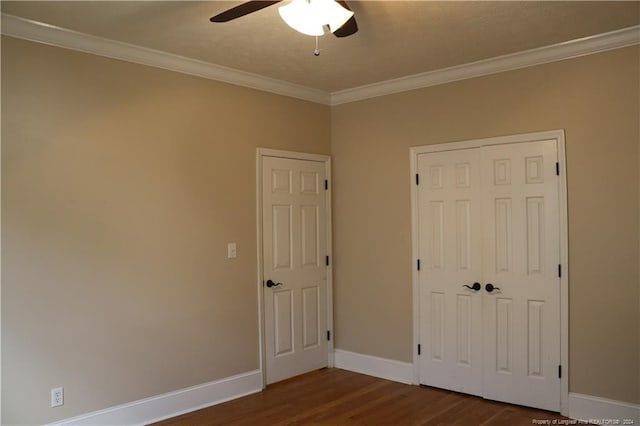 unfurnished bedroom with ceiling fan, crown molding, hardwood / wood-style flooring, and a closet